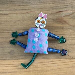 Whimsical Cat Brooch with Purple and Green Accents